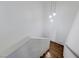 Wooden staircase with modern, decorative hanging light fixtures at 10078 Delicate Dew St, Las Vegas, NV 89183