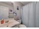 Bathroom featuring a vanity, toilet, shower curtain and a Disney-themed motif at 10342 Adrianna Ave, Las Vegas, NV 89129