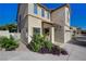 Charming two-story home featuring desert landscaping, with a tile roof and covered entry at 10342 Adrianna Ave, Las Vegas, NV 89129