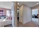 Hallway featuring access to bedrooms and an office, and neutral paint at 10342 Adrianna Ave, Las Vegas, NV 89129