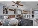 Open-concept living area with modern ceiling fan and view to kitchen; great for entertaining at 10342 Adrianna Ave, Las Vegas, NV 89129