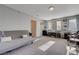 Large office space featuring a futon couch, multiple windows, and office furniture, perfect for productivity at 10342 Adrianna Ave, Las Vegas, NV 89129