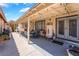 Enjoy a covered patio space with string lights, plants, and a seating area, great for entertaining at 1057 Neil Armstrong Cir, Las Vegas, NV 89145