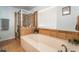 The tiled bathroom includes a soaking tub and a separate shower at 1057 Neil Armstrong Cir, Las Vegas, NV 89145