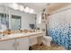 Bathroom featuring a single sink vanity and blue patterned shower curtain at 1057 Neil Armstrong Cir, Las Vegas, NV 89145