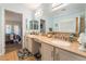 Bright bathroom featuring a double sink vanity and large mirror at 1057 Neil Armstrong Cir, Las Vegas, NV 89145