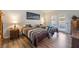 Cozy bedroom with two beds and access to a private outdoor space at 1057 Neil Armstrong Cir, Las Vegas, NV 89145