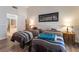 Well-lit bedroom with en-suite bathroom showcasing an open layout and modern decor at 1057 Neil Armstrong Cir, Las Vegas, NV 89145