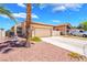 Charming single-story home featuring a desert landscaped yard, cozy courtyard, and a convenient two-car garage at 1057 Neil Armstrong Cir, Las Vegas, NV 89145
