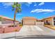 Charming single-story home with a well-maintained front yard and a spacious two-car garage at 1057 Neil Armstrong Cir, Las Vegas, NV 89145