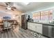 An open-concept layout with a kitchen featuring stainless steel appliances and plenty of counter space at 1057 Neil Armstrong Cir, Las Vegas, NV 89145