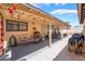 Covered patio with BBQ, dining set, and comfortable seating, perfect for outdoor gatherings at 1057 Neil Armstrong Cir, Las Vegas, NV 89145