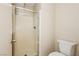 Modern bathroom features a glass-enclosed shower and a toilet at 1117 Coral Crystal Ct, North Las Vegas, NV 89032