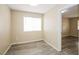 Cozy bedroom with wood-look flooring and bright natural light at 1117 Coral Crystal Ct, North Las Vegas, NV 89032