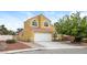 Charming two-story home with a two-car garage, red tile roof, and well-manicured front yard at 1117 Coral Crystal Ct, North Las Vegas, NV 89032