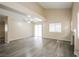 Open floor plan featuring hardwood floors, a fireplace, and sliding door access at 1117 Coral Crystal Ct, North Las Vegas, NV 89032