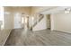 Bright living room with tall ceilings, hardwood floors, and a staircase at 1117 Coral Crystal Ct, North Las Vegas, NV 89032
