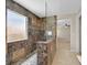 Modern tiled walk-in shower with glass divider, rainfall showerhead, and upgraded finishes at 11695 Rossovino St, Las Vegas, NV 89183