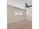 Carpeted bedroom with a ceiling fan and a bright window providing plenty of natural light at 11695 Rossovino St, Las Vegas, NV 89183