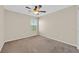 Empty bedroom with neutral carpeting, paint, a ceiling fan, and a window at 11695 Rossovino St, Las Vegas, NV 89183