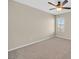 Neutral bedroom with a ceiling fan and natural light from a window at 11695 Rossovino St, Las Vegas, NV 89183