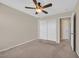 Bedroom with carpet flooring, ceiling fan and view of closet at 11695 Rossovino St, Las Vegas, NV 89183