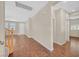 Inviting entryway with hardwood floors, a staircase, and a view of the home's interior featuring neutral walls and trim at 11695 Rossovino St, Las Vegas, NV 89183