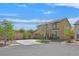 Two-story home with a driveway, attached garage and well-maintained landscaping on a sunny, clear day at 11695 Rossovino St, Las Vegas, NV 89183