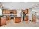 Spacious kitchen featuring an island, stainless steel appliances and tiled flooring with an open floorplan at 11695 Rossovino St, Las Vegas, NV 89183