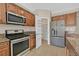 Well-equipped kitchen boasts stainless steel appliances, granite countertops and ample storage including a pantry at 11695 Rossovino St, Las Vegas, NV 89183