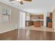 Open living space with hardwood floors, abundant natural light, and seamless transition to the kitchen at 11695 Rossovino St, Las Vegas, NV 89183