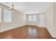 Bright and airy living room with hardwood floors, neutral paint, and ample windows, creating a welcoming atmosphere at 11695 Rossovino St, Las Vegas, NV 89183