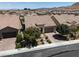 An aerial view of the house with a well-maintained roof and a clear view of the surrounding neighborhood at 12844 New Providence St, Las Vegas, NV 89141