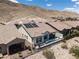 Home featuring a private backyard pool and spa combo and solar panels at 12844 New Providence St, Las Vegas, NV 89141