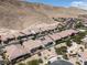 View of a home in a desert community featuring a pool and adjacent mountain view at 12844 New Providence St, Las Vegas, NV 89141