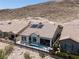 Aerial view of a single Gathering home with a tile roof and desert landscaping at 12844 New Providence St, Las Vegas, NV 89141