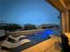 A captivating view of a backyard pool highlighting the waterfall feature into the sparkling blue water at 12844 New Providence St, Las Vegas, NV 89141