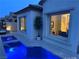 A captivating view of a backyard pool highlighting the waterfall feature into the sparkling blue water at 12844 New Providence St, Las Vegas, NV 89141