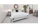 Comfortable bedroom featuring a queen-size bed with a white comforter, stylish side tables, and neutral decor at 12844 New Providence St, Las Vegas, NV 89141