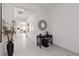 Bright foyer with a console table, decorative mirror, and elegant tile flooring at 12844 New Providence St, Las Vegas, NV 89141