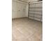 Spacious garage features a clean, tiled floor and an insulated door at 12844 New Providence St, Las Vegas, NV 89141