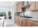 Granite counters, stainless appliances, and cabinetry highlight the well-equipped and stylish kitchen at 12844 New Providence St, Las Vegas, NV 89141