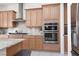 Well-equipped kitchen with stainless steel appliances, granite countertops, and ample cabinet space at 12844 New Providence St, Las Vegas, NV 89141