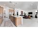 Stylish kitchen featuring a central island, open layout, and seamless connection to the living area at 12844 New Providence St, Las Vegas, NV 89141