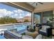 Inviting outdoor space with a pool featuring water features, comfortable seating, and mountain views at 12844 New Providence St, Las Vegas, NV 89141
