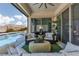 Relaxing outdoor living area with a pool, comfortable seating, and a view of the surrounding landscape at 12844 New Providence St, Las Vegas, NV 89141