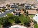 Aerial view of community park with covered picnic area, landscaping, and lush green grass at 12844 New Providence St, Las Vegas, NV 89141