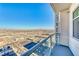Balcony featuring a partial view of the cityscape, with a glass railing and access to outdoor space at 150 Las Vegas Blvd # 2016, North Las Vegas, NV 89101