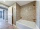 A full bath and shower with tile surround, with neutral wall colors, provide a modern and relaxing atmosphere at 150 Las Vegas Blvd # 2016, North Las Vegas, NV 89101