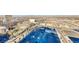 Aerial view of the city with parking lots and commercial buildings, showcasing the urban landscape and amenities at 150 Las Vegas Blvd # 2016, North Las Vegas, NV 89101
